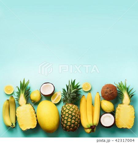 Fresh organic yellow fruits over blue background 42317004