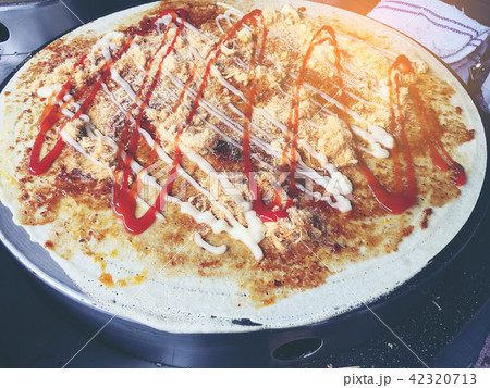 creperie is cooking Charcoal Crepe  42320713