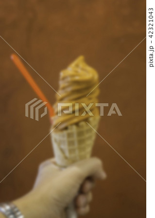 Thai tea soft serve ice cream cone, blur 42321043