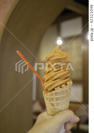 Thai tea soft serve ice cream cone 42321046