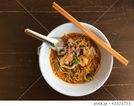 Delicious asian spicy seafood noodle soup  42321753