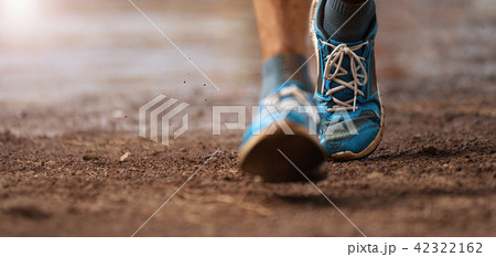 Trail running action close up of running shoes Trail running action close up of running shoes 42322162