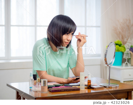 woman with makeup cosmetics woman with makeup cosmetics 42323026