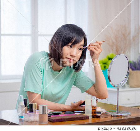 woman with makeup cosmetics woman with makeup cosmetics 42323036