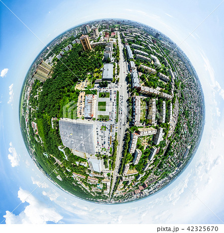 Aerial city view with crossroads and roads, houses, buildings, parks and parking lots. Sunny summer Aerial city view with crossroads and roads, houses, buildings, parks and parking lots. Sunny summer 42325670