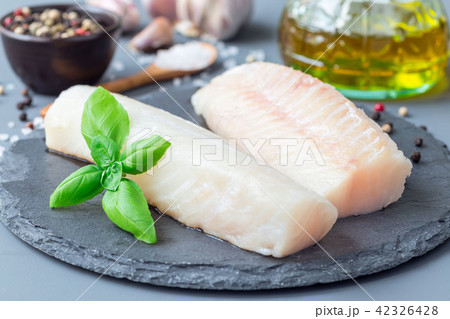 Fresh raw cod fillet with spices 42326428
