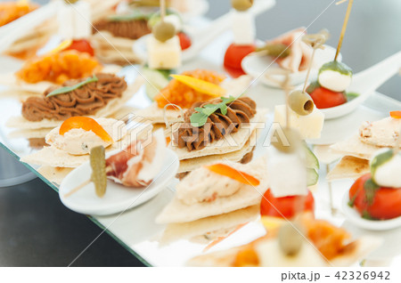 Snacks, fish and meat specialities on the buffet. 42326942