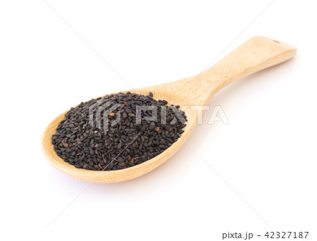 Black sesame on wooden spoon with white background 42327187