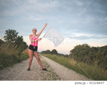 Teen Majorette Girl with White Flag Teen Majorette Girl with White Flag 42328647