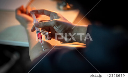 Junkie man injecting drug dose. Drug addiction Junkie man injecting drug dose. Drug addiction 42328659