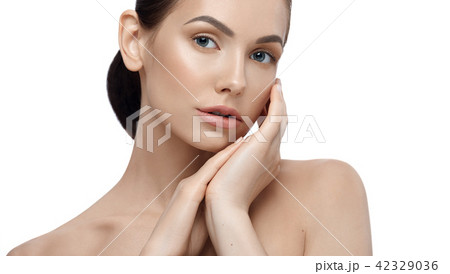 Portrait of model with perfect face posing touching her face. Portrait of model with perfect face posing touching her face. 42329036