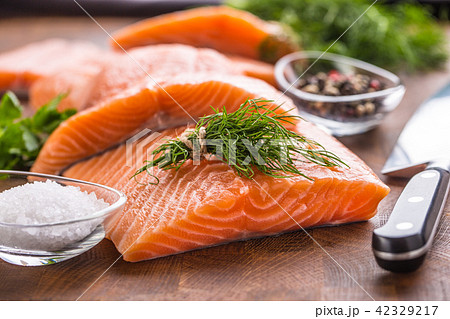Raw salmon fillet with dill lemon olive oil salt Raw salmon fillet with dill lemon olive oil salt 42329217