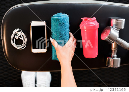mobile phone, earphones, towel, shaker and dumbbells 42331166