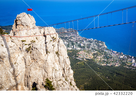 Rope bridge above chasm on Mount Ai-Petri, Crimea Rope bridge above chasm on Mount Ai-Petri, Crimea 42332220