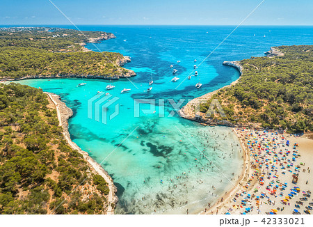 Aerial view of sandy beach, blue sea and yachts Aerial view of sandy beach, blue sea and yachts 42333021