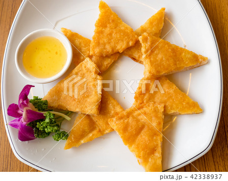 Fried moon shape shrimp cake with sauce Fried moon shape shrimp cake with sauce 42338937