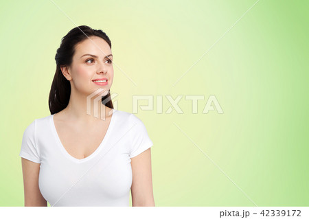 happy woman in white t-shirt over lime green 42339172