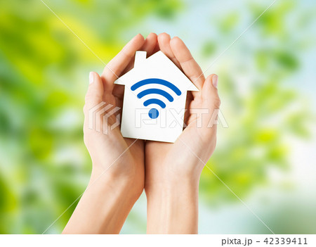 hands holding house with radio wave signal icon hands holding house with radio wave signal icon 42339411