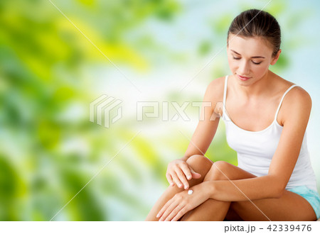 beautiful woman applying hand cream beautiful woman applying hand cream 42339476