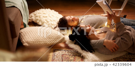happy couple reading book at home happy couple reading book at home 42339604