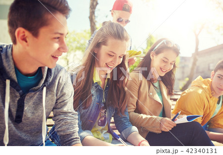 group of students with notebooks at school yard group of students with notebooks at school yard 42340131
