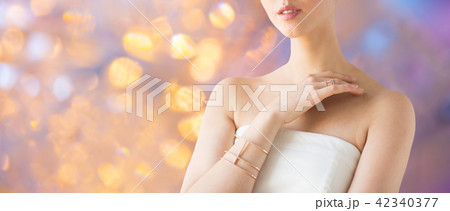 close up of beautiful woman with ring and bracelet close up of beautiful woman with ring and bracelet 42340377
