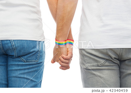 male couple with gay pride rainbow wristbands male couple with gay pride rainbow wristbands 42340459