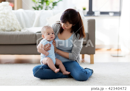 happy young mother with little baby at home 42340472
