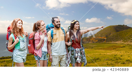 group of friends with backpacks on big sur coast 42340889