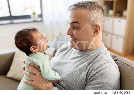 happy father with little baby boy at home 42340952