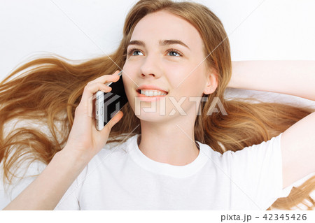 Beautiful young girl talking on the phone Beautiful young girl talking on the phone 42345426