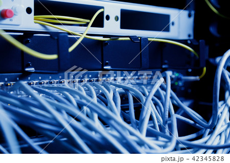Network panel, switch and cable in data center Network panel, switch and cable in data center 42345828