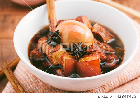 Eggs and pork in brown sauce,Thai Cuisine. 42348425