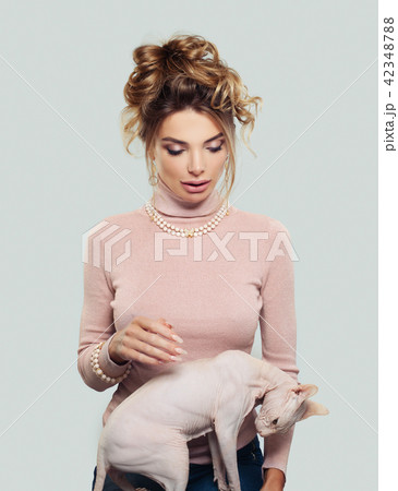 Beautiful Woman with her Cat 42348788