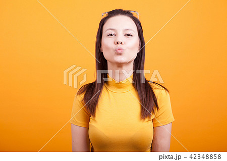 Pretty girl making kiss to the camera Pretty girl making kiss to the camera 42348858