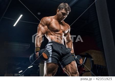 Young handsome male athlete bodybuilder, hard trai 42351925