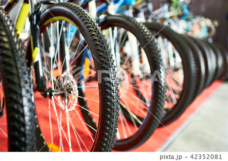 Modern mountain bikes in sports shop Modern mountain bikes in sports shop 42352081