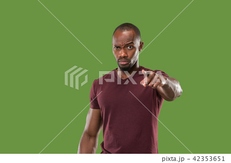 The overbearing businessman point you and want you, half length closeup portrait on green background 42353651