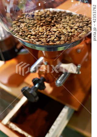 Coffee beans in grinder with millstones Coffee beans in grinder with millstones 42353762