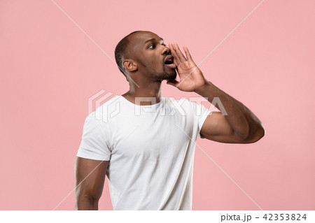 Isolated on pink young casual man shouting at studio Isolated on pink young casual man shouting at studio 42353824