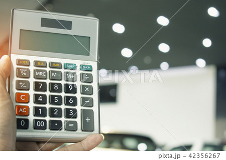 man pressing calculator for business finance 42356267