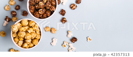 Sweet and salted popcorn on a blue background 42357313