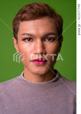 Androgynous young Asian man wearing makeup Androgynous young Asian man wearing makeup 42357740