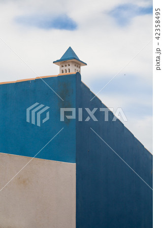 Blue wall house and a chimney 42358495