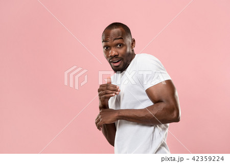 Beautiful male half-length portrait isolated on pink studio backgroud. The young emotional surprised Beautiful male half-length portrait isolated on pink studio backgroud. The young emotional surprised 42359224