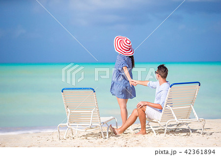 Couple relax on a tropical beach at Maldives Couple relax on a tropical beach at Maldives 42361894
