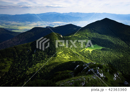 view of the valley on a mountain green saddle view of the valley on a mountain green saddle 42363360