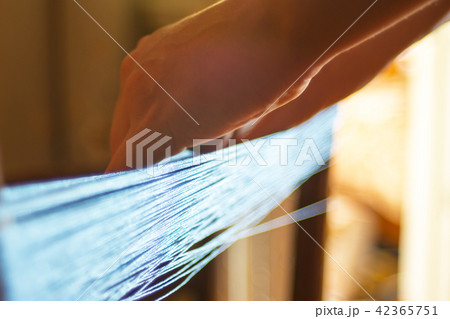 Woman spooling yarn. 42365751