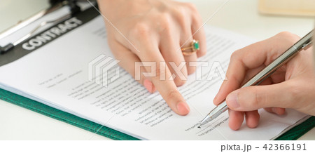 Businesswoman signs agreement contract in office. 42366191