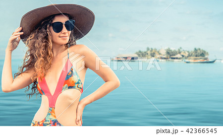 Happy young woman at beach in summer vacation. 42366545
